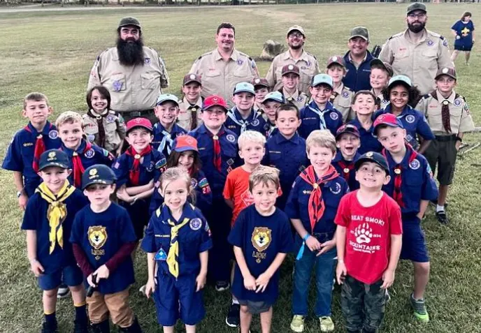 Pack 275 Scouts and leaders together outdoors
